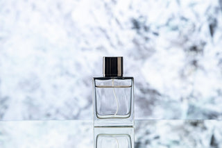 An image of a perfume in a winter based chilly background